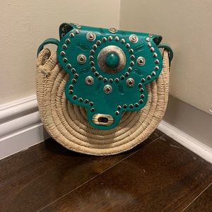 Straw bag with leather and stone details